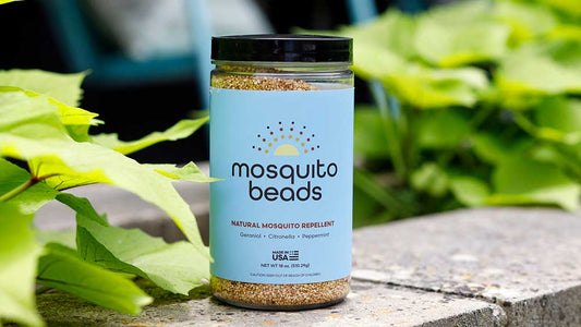 Mosquito Beads "The Signature" 18oz jar on a patio